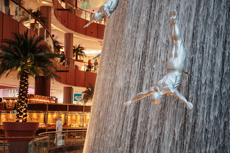 DUBAI, UAE - OCTOBER 31: Famous Waterfall in Dubai Malll on October 31, 2013 in Dubai. At over 12 million sq ft, it is the world's largest shopping mall based on total area.のeditorial素材
