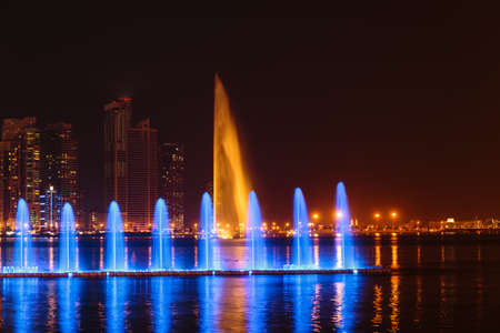 SHARJAH, UAE - OCTOBER 29, 2013: Musical fountain show. The Sharjah Fountain is one of the biggest fountains in the region.のeditorial素材