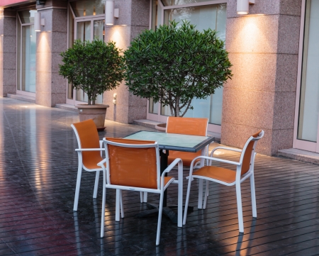 Table and chair on the streetの写真素材