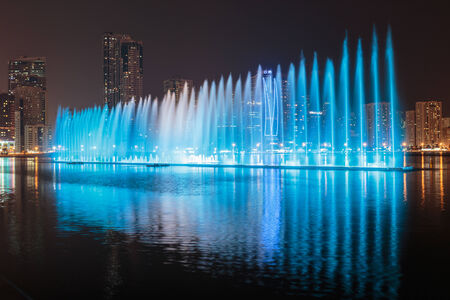 SHARJAH, UAE - OCTOBER 29, 2013: Musical fountain show. The Sharjah Fountain is one of the biggest fountains in the region.のeditorial素材
