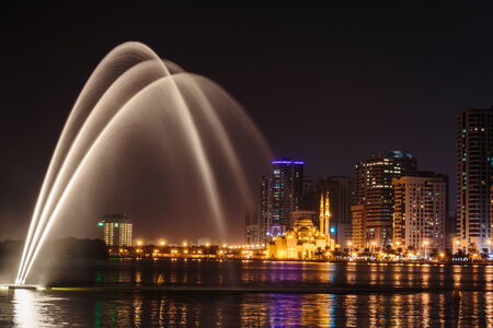 SHARJAH, UAE - OCTOBER 29, 2013: Musical fountain show. The Sharjah Fountain is one of the biggest fountains in the region.のeditorial素材