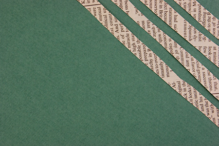 Collage cut from newspaper on green background