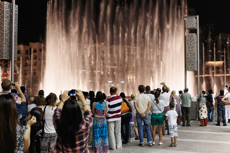 DUBAI, UAE - OCTOBER 31, 2013: Fountain in the lake near Dubai Mall. Lake - 6600 lights and 25 projectors, it shoots water 150 m into the air. United Arab Emirateのeditorial素材