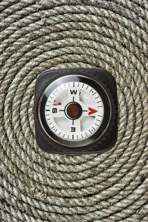 compass on old twisted ropeの写真素材