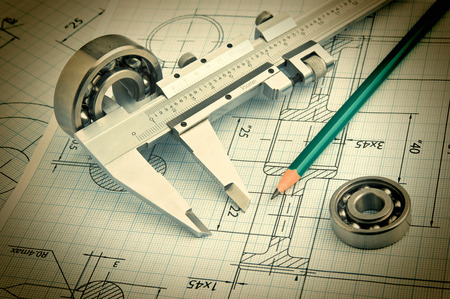 Old technical drawing and caliper with bearingの写真素材
