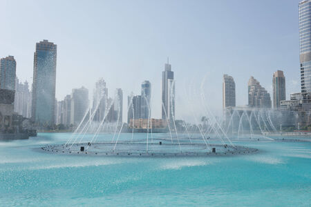 DUBAI, UAE - NOVEMBER 14: The Dancing fountains downtown and in a man-made lake in Dubai, UAE on November 14, 2012. The Dubai Dancing fountains are world's largest fountains with height 150 m.のeditorial素材