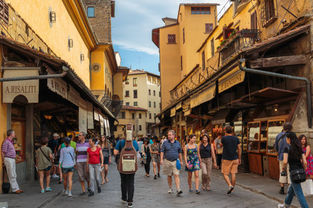 FLORENCE, ITALY - 23 JUNE, 2014: Tourists walk on the bridge Ponte Vecchio in Florenceのeditorial素材