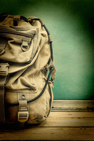 old travel backpack on the floorの写真素材