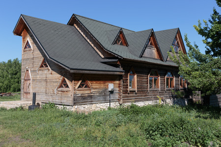 wooden house with a slate roof in the villageのeditorial素材