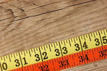sartorial meter on the old wooden backgroundの写真素材