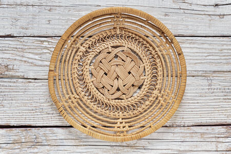 Empty basket on an old wooden tableの写真素材