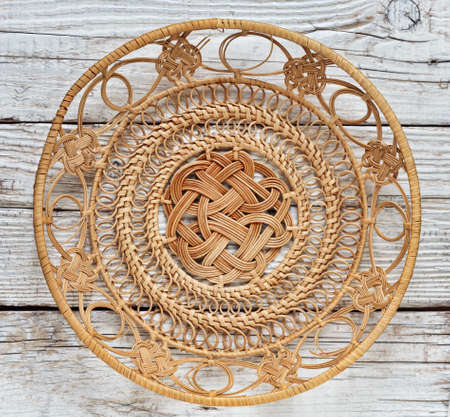 Empty basket on an old wooden tableの写真素材