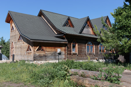 wooden house with a slate roof in the villageのeditorial素材