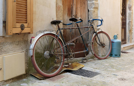 Bicycle on the old street in the village Coaraze, Franceの写真素材