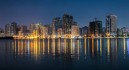 SHARJAH, UAE - OCTOBER 29: Night view of Sharjah, on October 29, 2013. Sharjah is located along northern coast of Persian Gulf on Arabian Peninsulaのeditorial素材