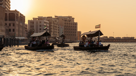 DUBAI, UAE-NOVEMBER 8, 2013: Ship in Port Saeed at sunset. The oldest commercial port of Dubaiのeditorial素材