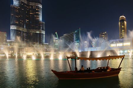 DUBAI, UAE - NOVEMBER 13: Night view Dancing fountains downtown and in a man-made lake in Dubai, UAE on November 13, 2013. The Dubai Dancing fountains are world's largest fountains with height 150 m.のeditorial素材
