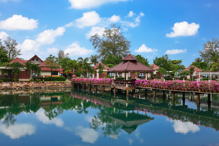 KOH CHANG, THAILAND - 31 MART, 2015: Klong Prao Resort. Bridge with flowers across the bay in a tropical gardenのeditorial素材