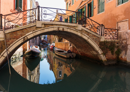 Bridge over a narrow canal in Veniceの写真素材