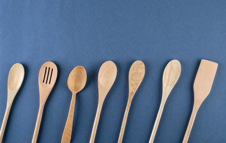 wooden spoons on a blue background