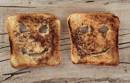 Happy toast on an old wooden boardの写真素材