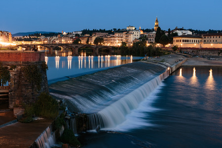 Embankment of the river Arno in Florence at nightの写真素材