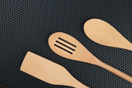 wooden spoon is handmade on a dark backgroundの写真素材