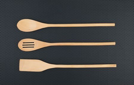 wooden spoon is handmade on a dark backgroundの写真素材