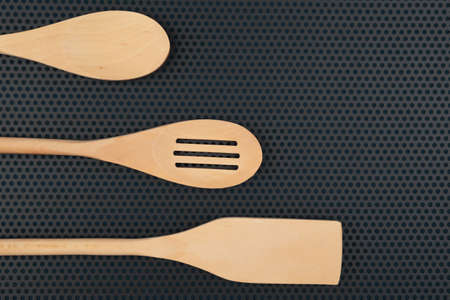 wooden spoon is handmade on a dark backgroundのeditorial素材
