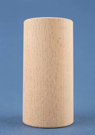 wooden geometric shapes on a blue backgroundの写真素材