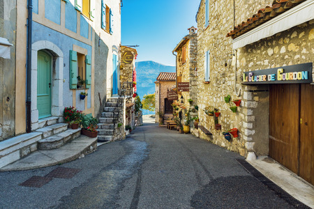 GOURDON, FRANCE - OCTOBER 31, 2014: Narrow cobbled streets with flowers in the old villageのeditorial素材
