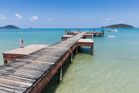 Old wooden jetty on exotic beach Koh Chang island, Thailandの写真素材