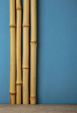 dry bamboo stalks and wooden shelf