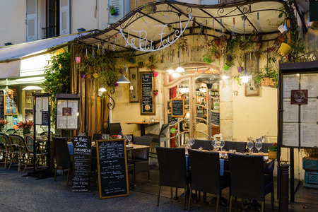 MOUGINS, FRANCE - OCTOBER 31, 2014: Street cafe at nightのeditorial素材