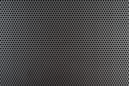Metallic background with perforation of round holesの写真素材