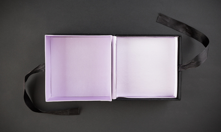 An empty gift box on a black background