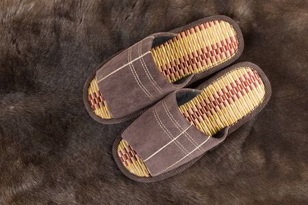 House slippers on a fur rugの写真素材