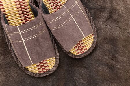 House slippers on a fur rugの写真素材