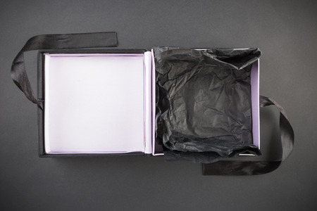 An empty gift box on a black backgroundの写真素材