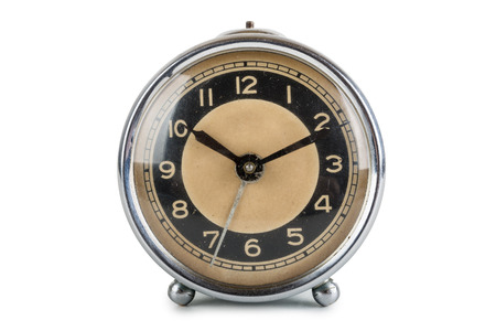 Old alarm clock isolated on white background