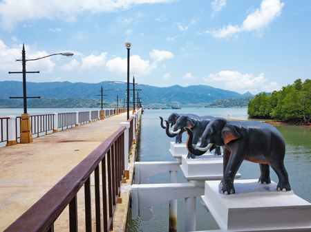 Stone jetty on exotic beach of a tropical island Koh Chang,Thailandの写真素材