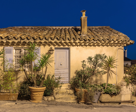 Facade of the old house in medieval village France. Night viewの写真素材