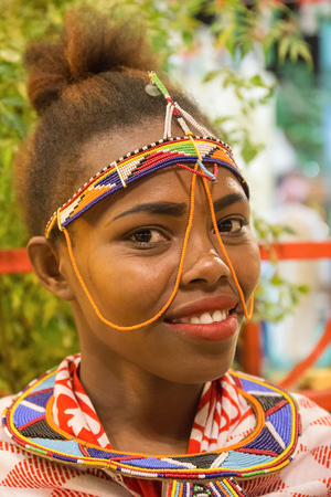 DUBAI, UAE - DECEMBER 4, 2017: Portrait of an African girl to meet guests in the pavilion Africa of entertainment center Global Villageのeditorial素材
