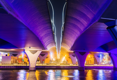 DUBAI, UAE - NOVEMBER 29, 2017: Colorful illuminated Waterfall. The Waterfall is part of the Dubai Water Canal development.のeditorial素材