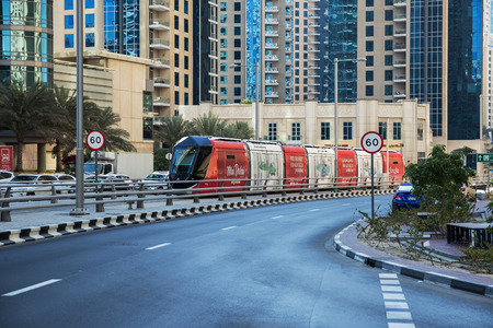 DUBAI, UAE - NOVEMBER 29, 2017: Travel tramcar in the area of Dubai Marinaのeditorial素材