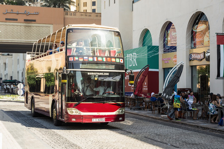 DUBAI, UAE - NOVEMBER 30, 2017: Travel bus on the Jumeirah Beach Residence JBR in Dubai Marinaのeditorial素材