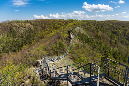 Metal pedestrian bridge in the mountainsの写真素材