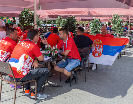 MOSCOW, RUSSIA - June 27, 2018: Football fans from Serbia in the bar streetのeditorial素材
