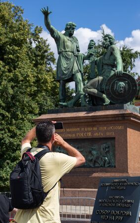 MOSCOW, RUSSIA - June 27, 2018: A man tourist  makes a selfie on Red Squareのeditorial素材