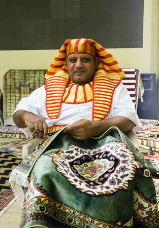 DUBAI, UAE - DECEMBER 4, 2017: Man in national costume in the pavilion of Egypt in Global Villageのeditorial素材